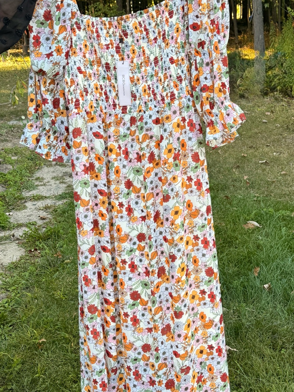 BCBGeneration White Floral Off-Shoulder Maxi Dress with Orange & Red Blooms